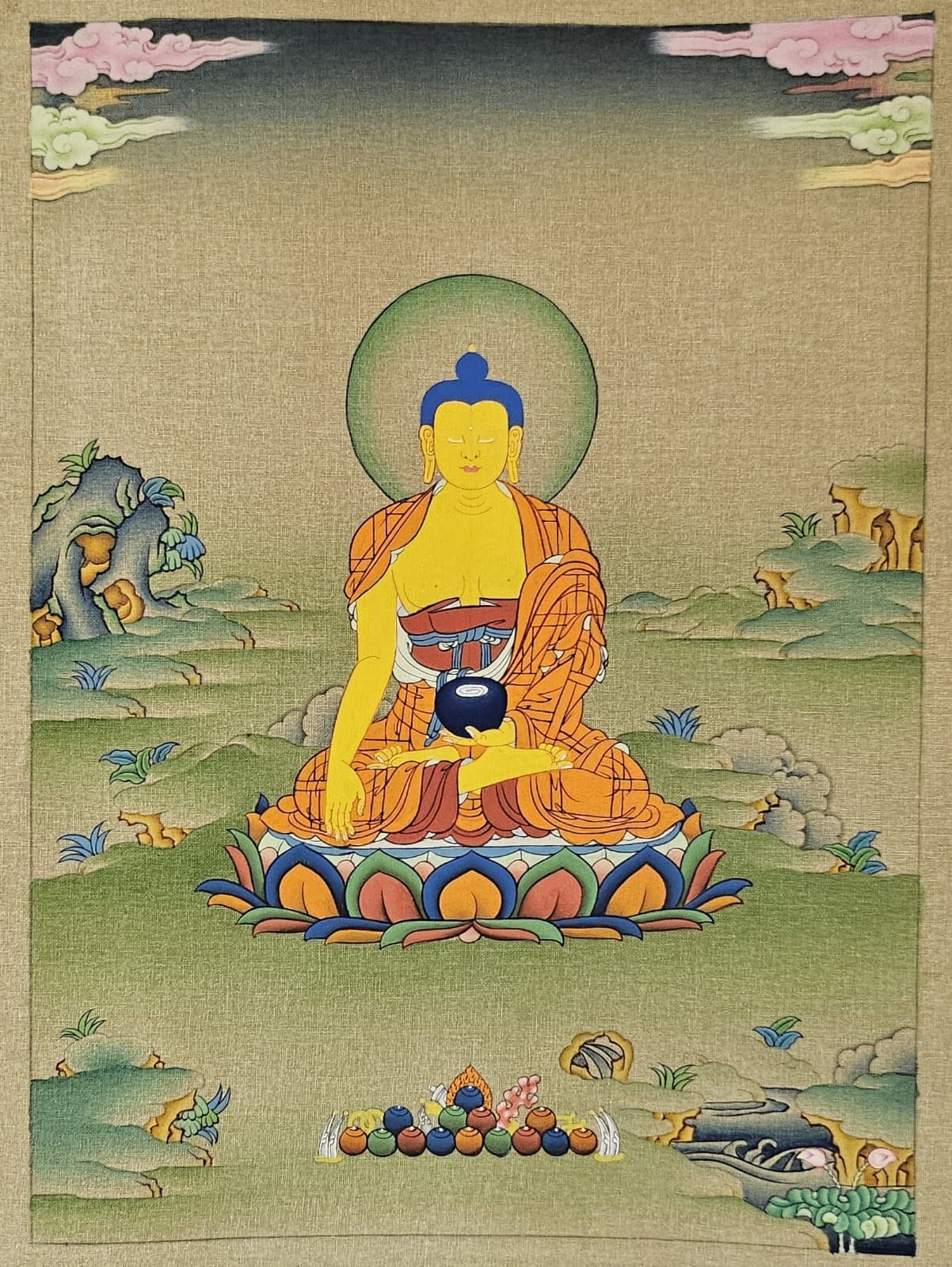 Shading added to the robes and landscape, with the Buddha's face now painted